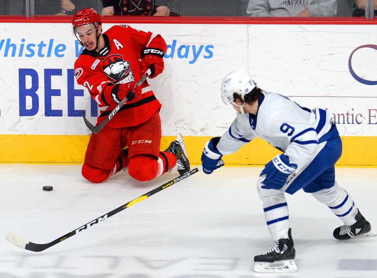 Center Andrew Poturalski, left, is one of eight Charlotte Checkers players who faced the Chicago Wolves during the 2017 AHL playoffs. The teams will open the Calder Cup Finals in Charlotte on Saturday.