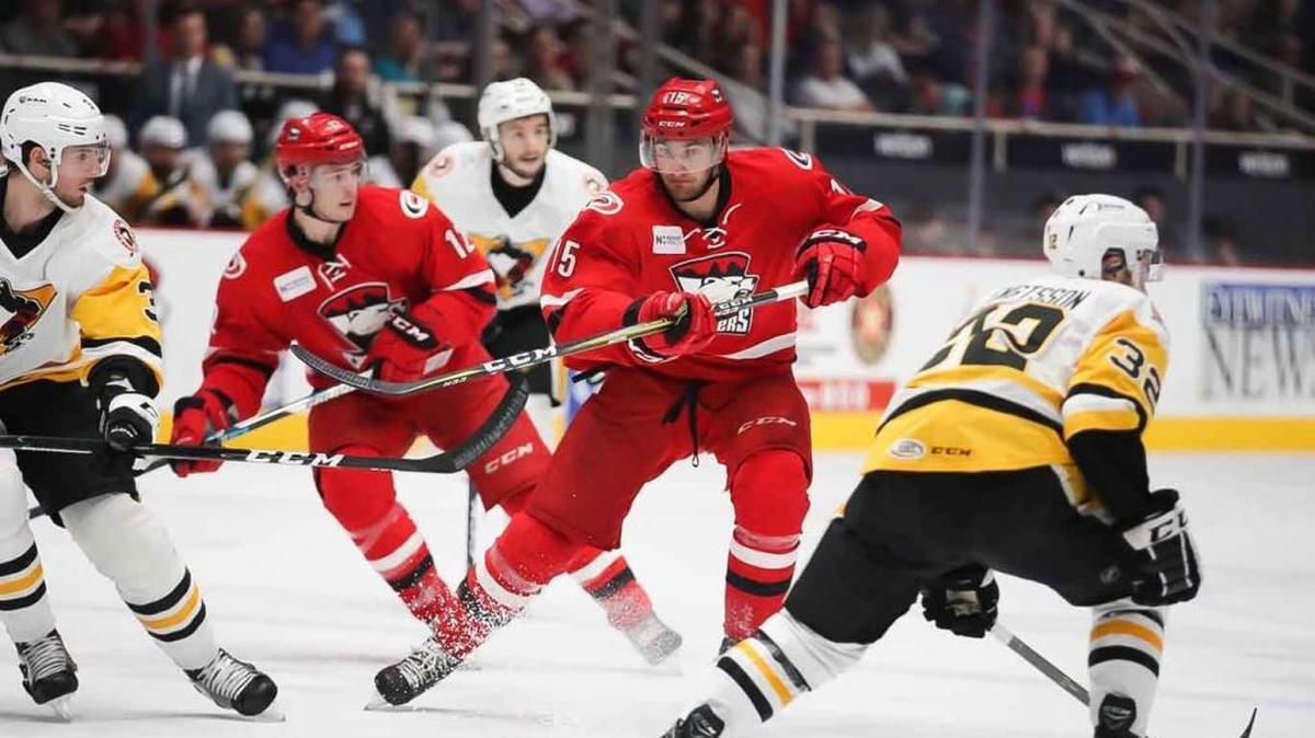 Charlotte Checkers’ Nicolas Roy (15) looks to split the defenders in a first-round American Hockey League playoff win. Charlotte will face AHL Atlantic champion Lehigh Valley in the second round, with the series opening Friday in Allentown, Pa.