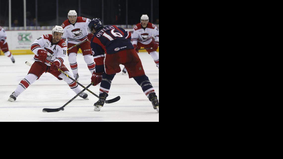 
Charlotte Checkers' Kyle Hagel, left, and Grand Rapids Griffins Xavier Ouellet fight for the puck in the first period Tuesday in March. This weekend, the Checkers say farwell to Time Warner Cable Arena.
