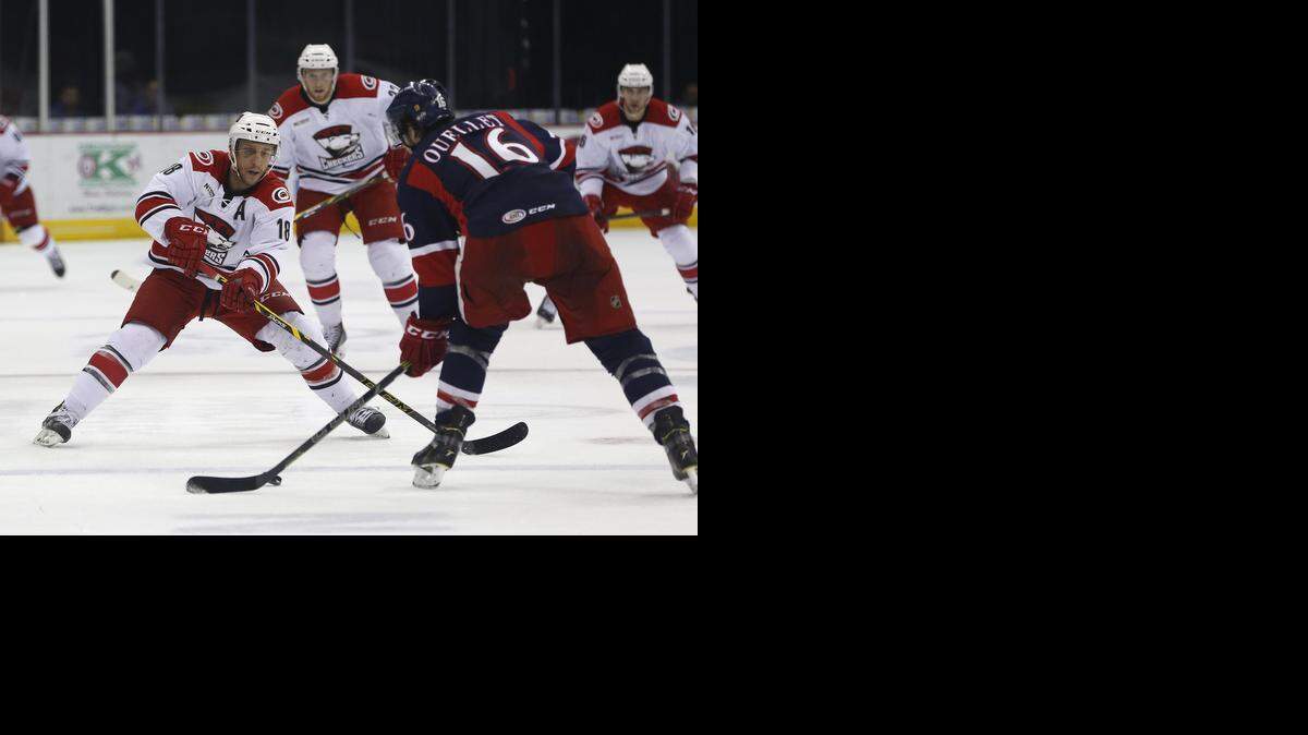 
Charlotte Checkers' Kyle Hagel, left, and Grand Rapids Griffins Xavier Ouellet fight for the puck in the first period Tuesday in March. This weekend, the Checkers say farwell to Time Warner Cable Arena.
