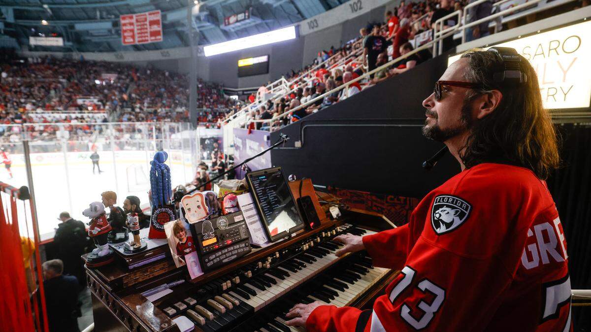 Organist and keytarist Jason Atkins, also known as Greazy Keyz, plays a Hammond C3 Organ, a 450-pound instrument that has been associated with the Charlotte Checkers since the 1950s, during the Calder Cup opener between the Checkers and Canucks at Bojangles Coliseum in Charlotte, NC on Friday, June 13, 2025.