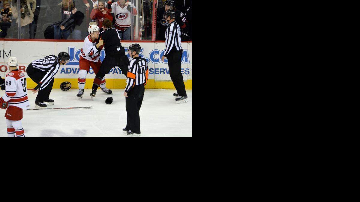 
Checkers defenseman Mike Cornell and the Monsters’ Reid Petryk fight during the first period of Sunday’s 5-1 Checkers’ loss at Time Warner Cable Arena. 


