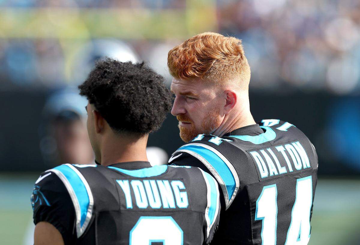 Carolina Panthers quarterbacks Bryce Young, left and Andy Dalton, right, talk along the team’s sideline during first-half action against the New Orleans Saints at Bank of America Stadium in Charlotte, NC on Sunday, November 3, 2024. The Panthers defeated the Saints 23-22.