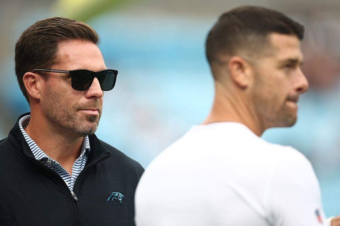 Carolina Panthers general manager Dan Morgan, left, and head coach Dave Canales at a 2025 preseason game at Bank of America Stadium. 