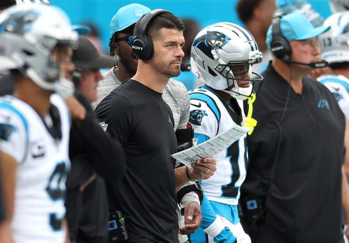 Carolina Panthers head coach Dave Canales, center, watches the team's defense battle the Miami Dolphins on Sunday, October 5, 2025 at Bank of America Stadium in Charlotte, NC. The Panthers defeated the Dolphins 27-24.