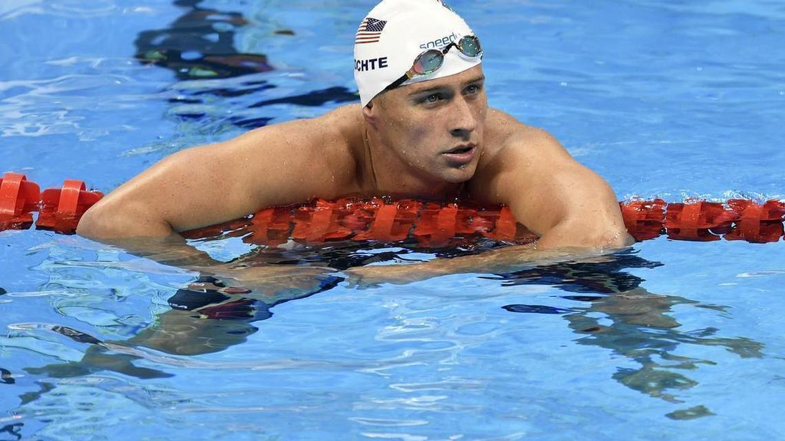 Ryan Lochte checks his time after a men' 4x200-meter freestyle relay heat during the swimming competitions at the 2016 Summer Olympics in Rio de Janeiro, Brazil. The father of the American swimmer said Wednesday, Aug. 17, his son arrived back in the United States before a Brazilian judge ordered that Lochte stay in Brazil as authorities investigate a robbery claim involving the athlete during the Olympics.