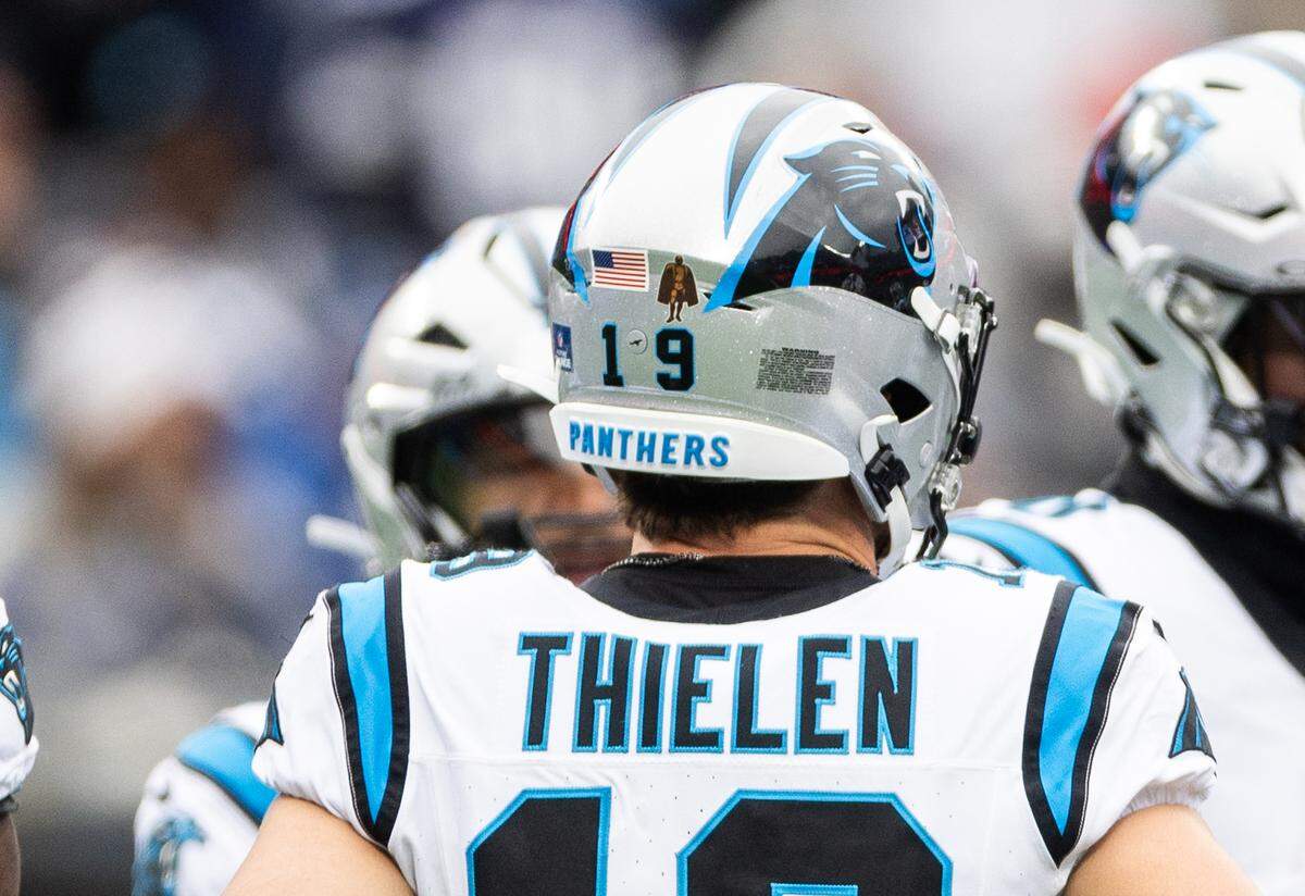 Carolina Panthers wide receiver Adam Thielen’s helmet shows Walter Payton “Man of the Year” decal at the Bank of America Stadium in Charlotte, N.C., on Sunday, December 15, 2024.