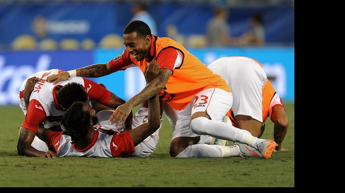 
Trinidad & Tobago players celebrate their 4-4 tie with Mexico during Gold Cup '15 action on Wednesday, July 15, 2015 at Bank of America Stadium in Charlotte.
