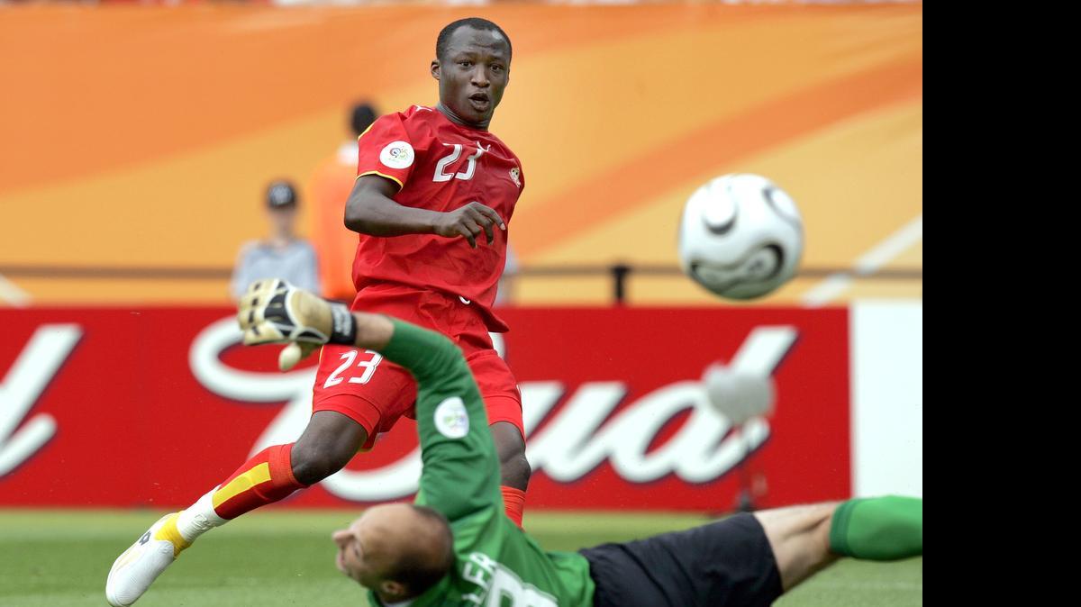 
Ghana's Haminu Draman, top, scores his side's first goal during the USA vs. Ghana World Cup Group E soccer match at the Franken Stadium in Nuremberg, Germany, June 22, 2006. 
