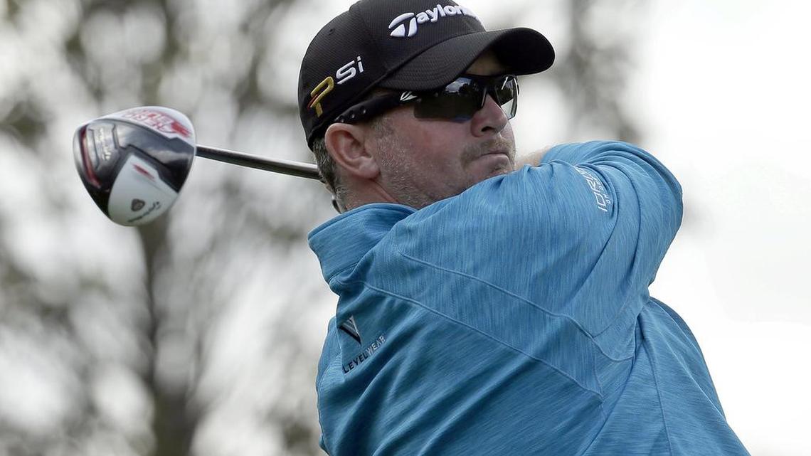 Steve Wheatcroft watches his tee shot on the 16th hole during Thursday’s first round of the Wells Fargo Championship at Quail Hollow Club. He finished the day with a 7-under 65 to share the lead with Andrew Loupe.