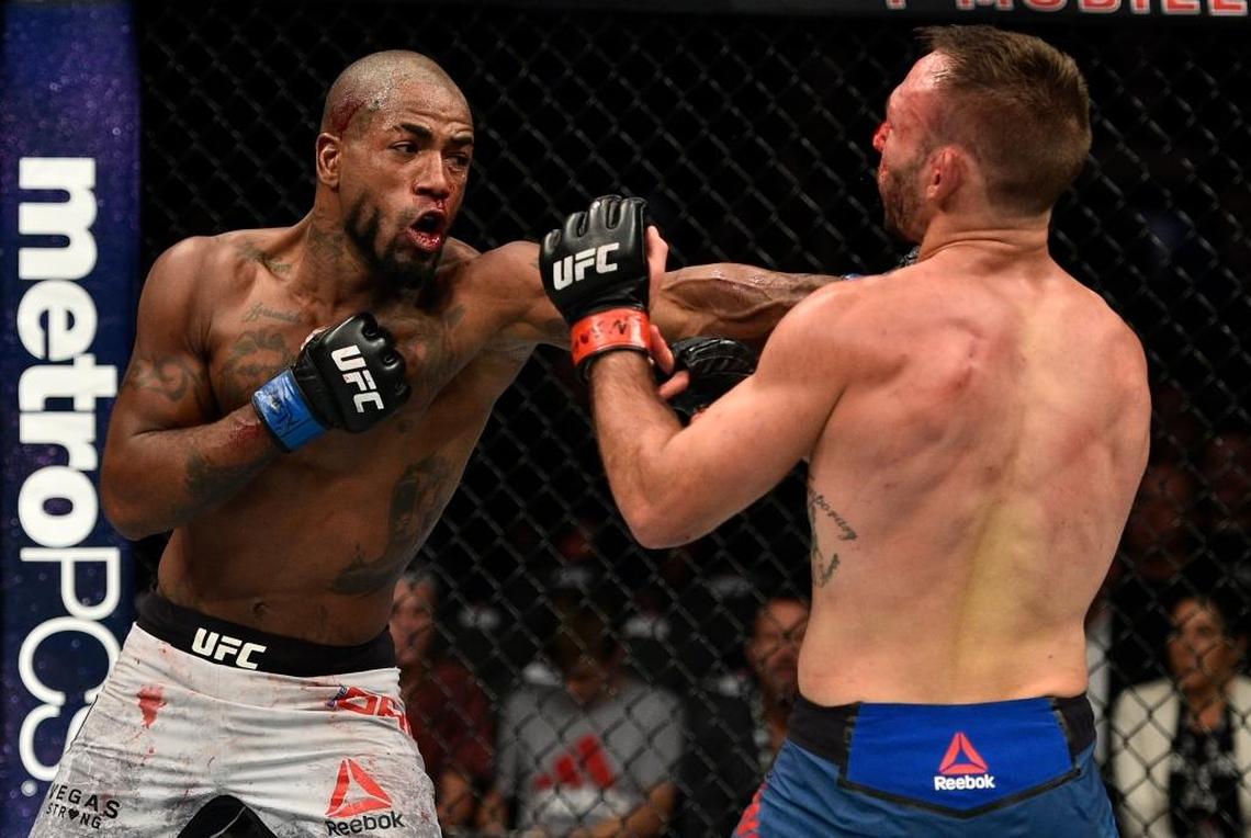 Bobby Green punches Lando Vannata in their lightweight bout during the UFC 216 event inside T-Mobile Arena on Oct. 7 in Las Vegas.
