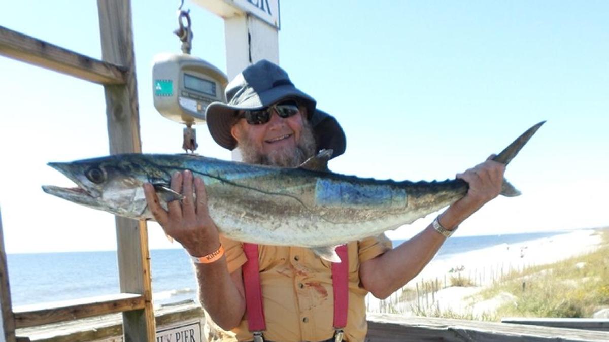 David Patterson of Hillsborough, N.C., holds a 22-pound king mackerel he caught at Oak Island Pier in Oak Island, N.C.