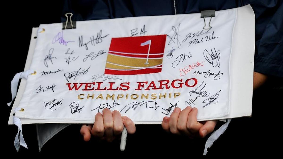 A young fan waits to obtain more golf signatures on Tuesday at Quail Hollow Club in Charlotte. First-round Wells Fargo Championship action begins Thursday morning.