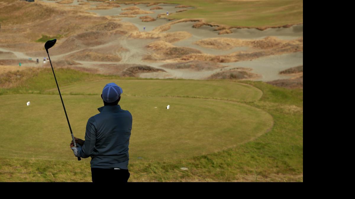 
Rory McIlroy watches his tee shot on the 14th hole during a practice round Wednesday for the U.S. Open at Chambers Bay in University Place, Wash. 
