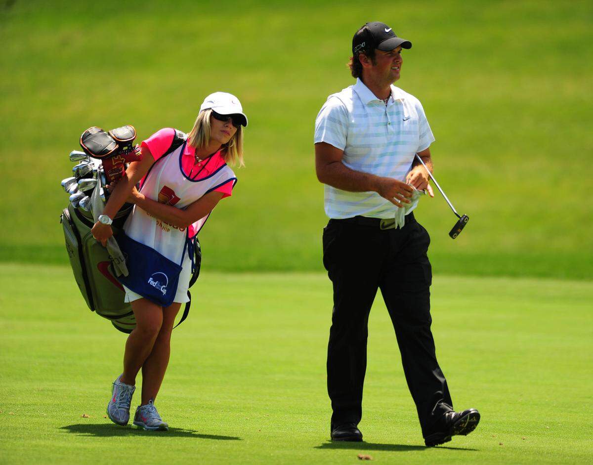 Patrick Reed and his caddie walk up the 18th fairway during the first round of the Wells Fargo Championship at Quail Hollow Club on May 3, 2012. JEFF SINER - jsiner@charlotteobserver.com