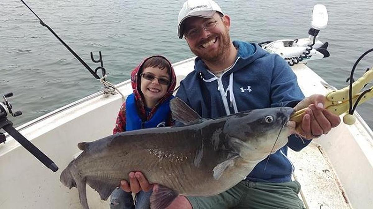 Martin Karwoski of Indian Trail and his son Owen, 5 1/2, with a 15-pound blue catfish the youngster caught Saturday at Lake Norman. It was the largest of 20 blues boated while the two fished with Bill Ward of Denver, N.C., on the lake’s Davidson Creek arm. Owen reeled in 17 of the fish, shouting “I got this!” each time one took their baits, a mix of chicken strips and cut white perch.
