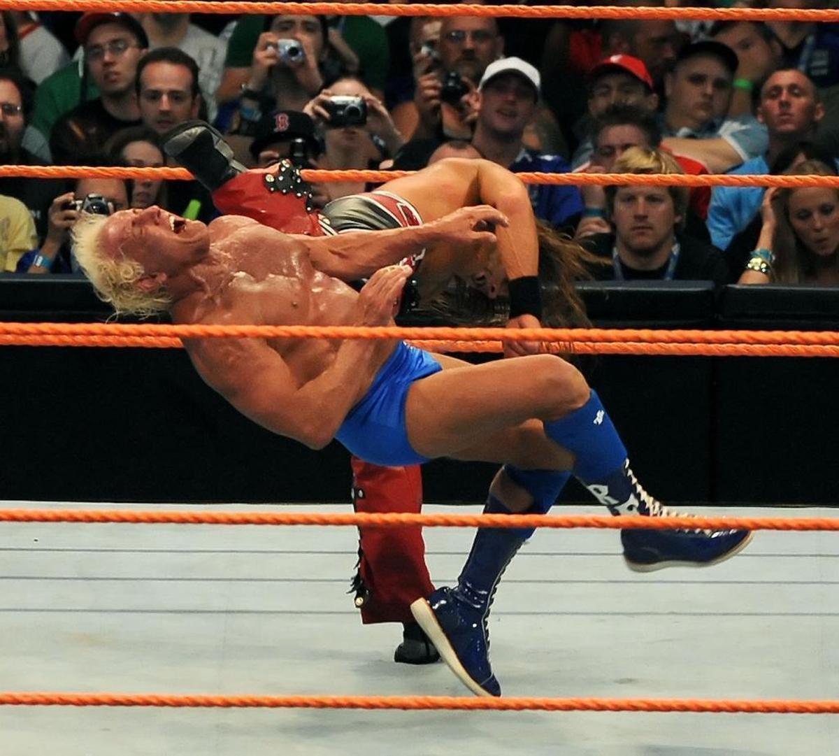 Ric Flair takes a hit from Shawn Michaels in their legendary match that marked Flair’s retirement, at Wrestlemania 23 in Orlando.