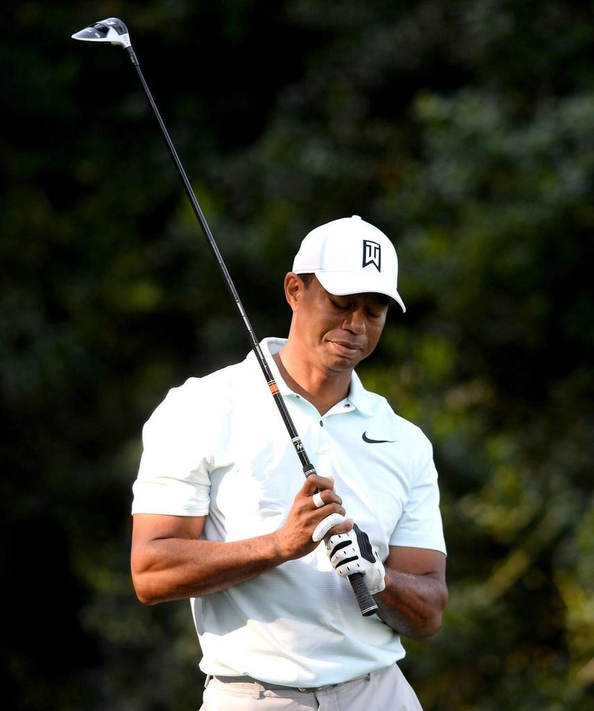 Tiger Woods reacts after his drive on the 14th hole during Friday’s second round of the Wells Fargo Championship at Quail Hollow Club.