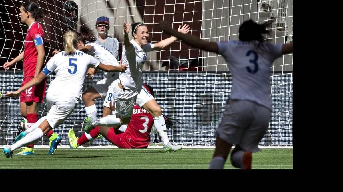 
England defender Lucy Bronze (C) celebrates her goal against Canada at the 2015 FIFA Women's World Cup at BC Place Stadium in Vancouver on June 27, 2015. 
