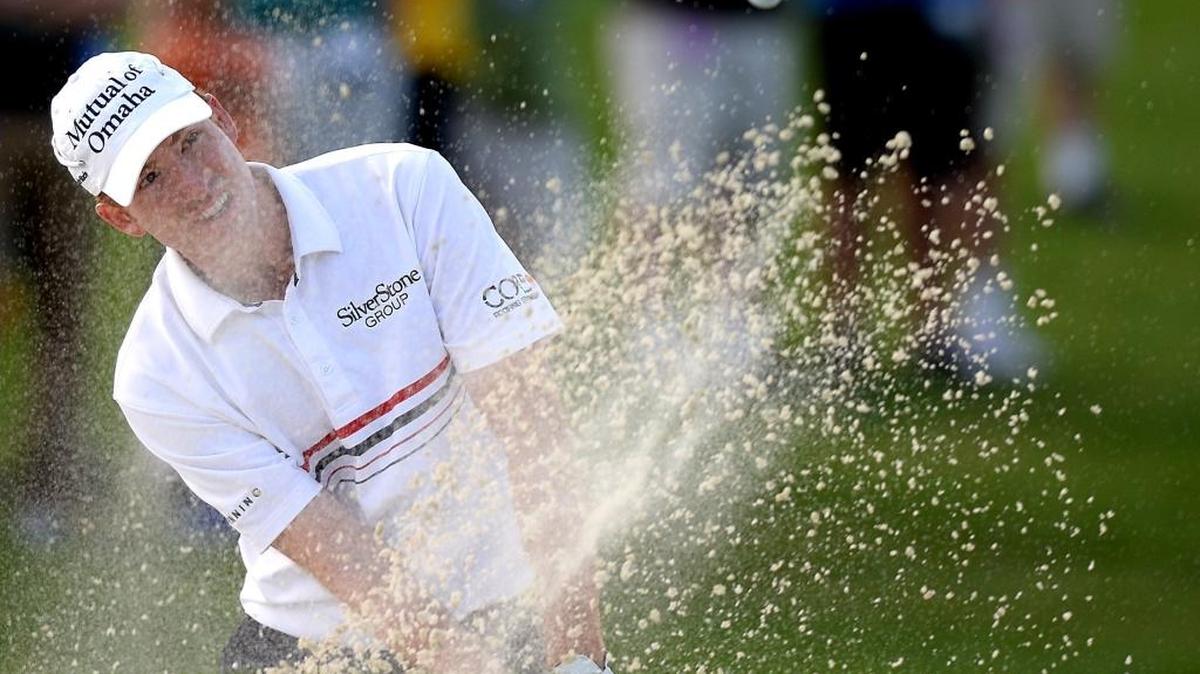 Roberto Castro hits from a sand bunker along the 16th green Saturday during third-round action of the Wells Fargo Championship at Quail Hollow Club in Charlotte. Castro finished the round in second place at 8 under.