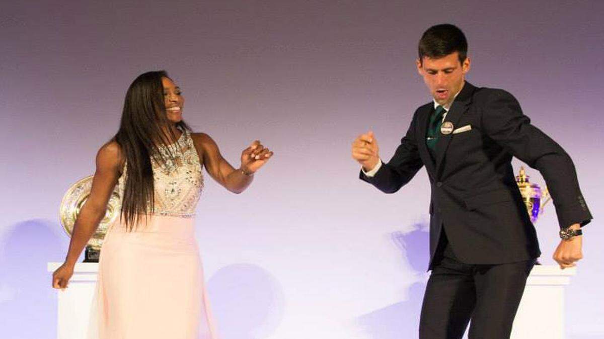 Novak Djokovic, right, and Serena Williams dance together to "Night Fever," the Bee Gees' disco hit from the 1977 movie "Saturday Night Fever" starring John Travolta.