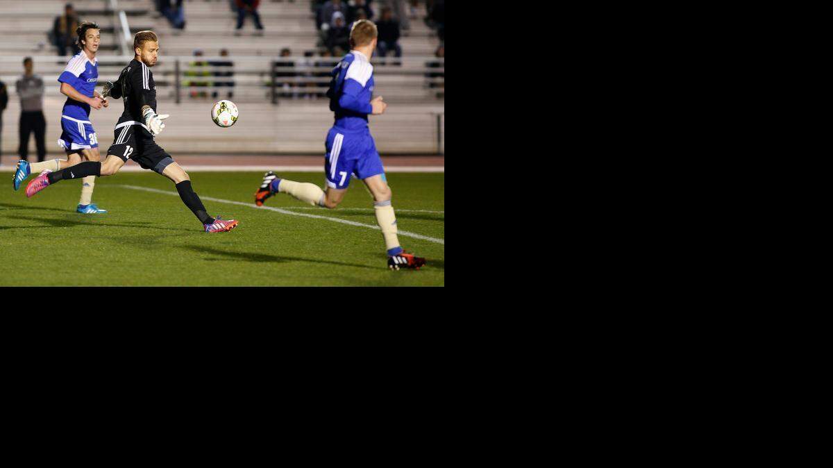 
Charlotte Independence goalkeeper John Berner, center, kicks the ball downfield against the Charleston Battery in first half of United Soccer League game played at UNCC Transamerica Field. 
