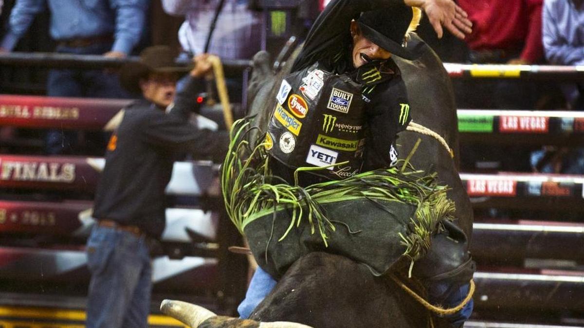 J.B. Mauney battles a ride on Wicked Stick on his way to first place during Round 1 of the 2015 PBR World Finals rodeo at the Thomas & Mack Center in Las Vegas on Wednesday, Oct. 21, 2015.