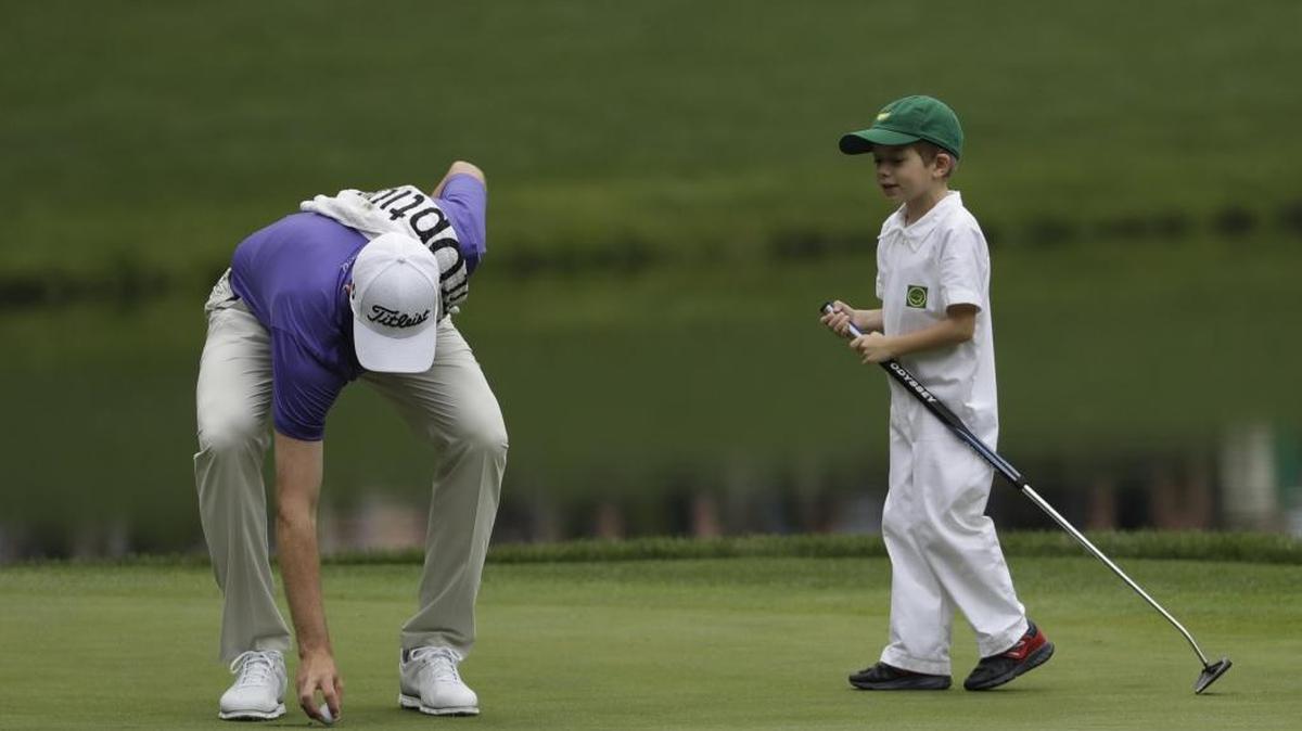 Webb Simpson (left) and son James during the par-3 competition at the Masters tournament Wednesday.