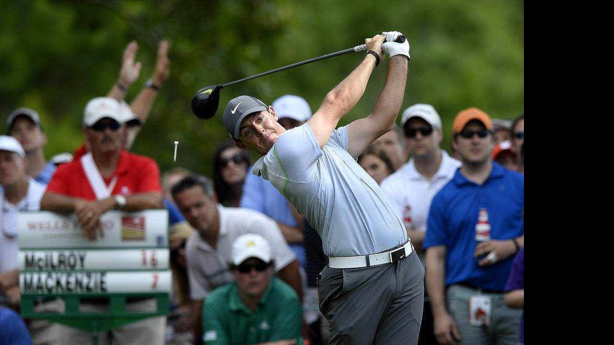 
Rory McIlroy follows through on his drive from the 15th tee box during third-round action in the Wells Fargo Championship at Quail Hollow Club in Charlotte, Saturday, May 16, 2015. McIlroy finished at -18.
