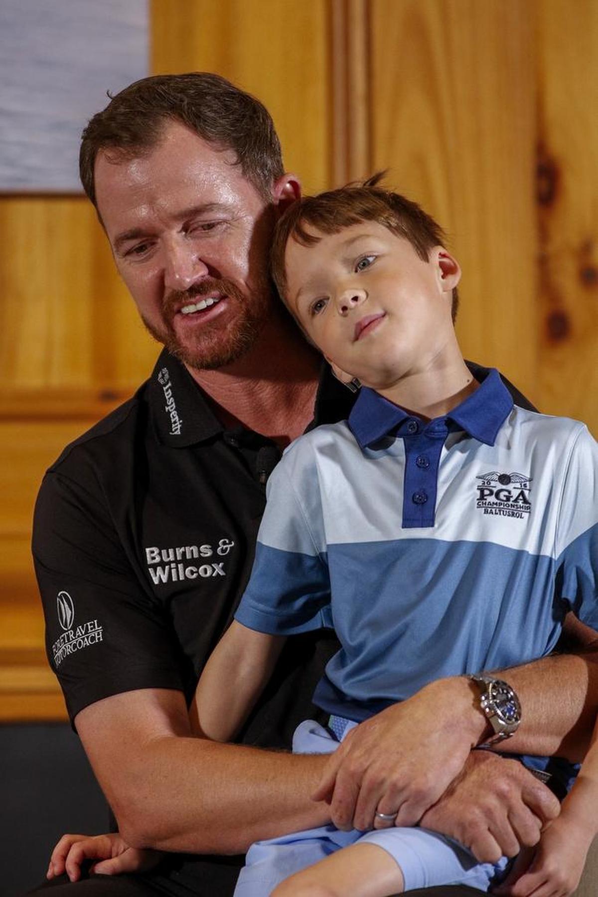 PGA Tour star Jimmy Walker, with son Mclain, answers questions at Monday’s PGA Championship Media Day at Quail Hollow Club. Walker won last year’s PGA Championship at Baltusrol Golf Club (N.J.).