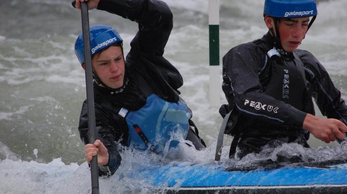 Wes Bolyard of Charlotte, front and Miller Kaderabek of Asheville paddle a tandem canoe at the National Whitewater Center in March practicing for the US. Olympic trials this week.