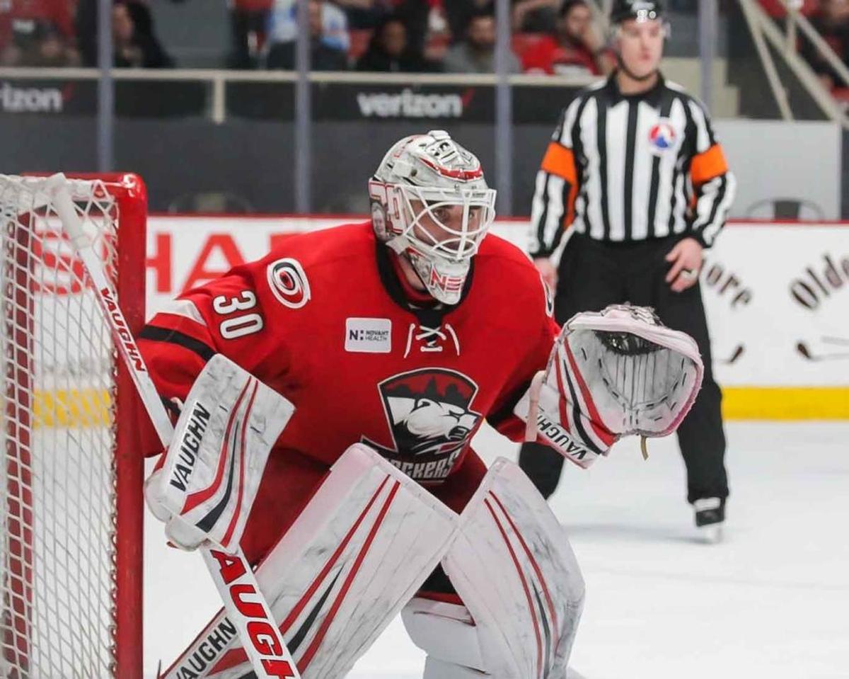 Charlotte Checkers goalie Alex Nedeljkovic (30) made 26 saves in Thursday night’s game. The Checkers came from behind to beat the host Wilkes-Barre/Scranton Penguins 7-3, sweeping their first-round American Hockey League playoff series in three games.