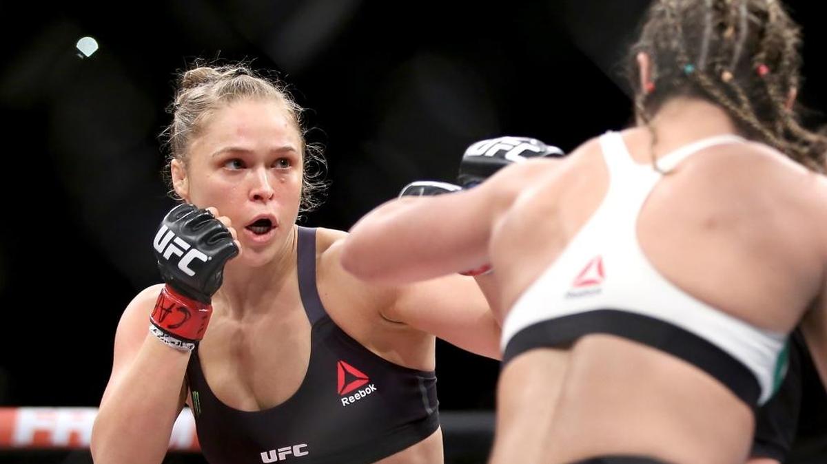 
Ronda Rousey (left) fights Bethe Correia during the UFC 190 on August 1, 2015 in Rio de Janeiro, Brazil. The MMA fighter accepted the invitation of a North Carolina Marine to attend his Marine Corps Ball in a TMZ Sports video.
