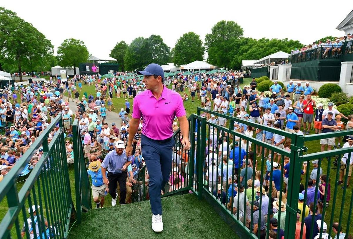 Rory McIlroy glances back toward the 18th green as he walks to the clubhouse after Saturday’s third round of the Wells Fargo Championship at Quail Hollow Club.