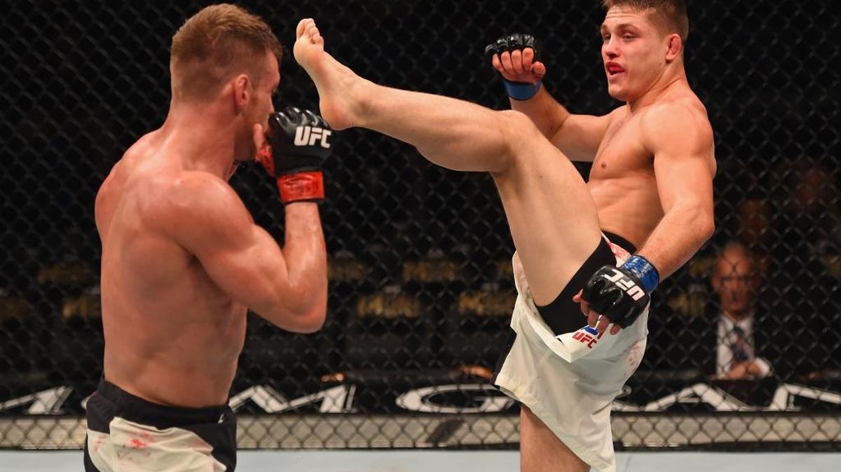 Drew Dober kicks Scott Holtzman in their lightweight bout during the UFC 195 event inside MGM Grand Garden Arena on Jan. 2, 2016, in Las Vegas, Nev.