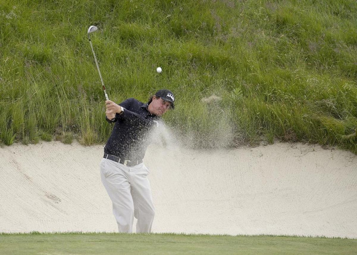 Phil Mickelson, hitting out of a bunker on Wednesday during a practice round at Shinnecock Golf Club in Southampton, N.Y., has finished runner-up six times in the U.S. Open Championship.