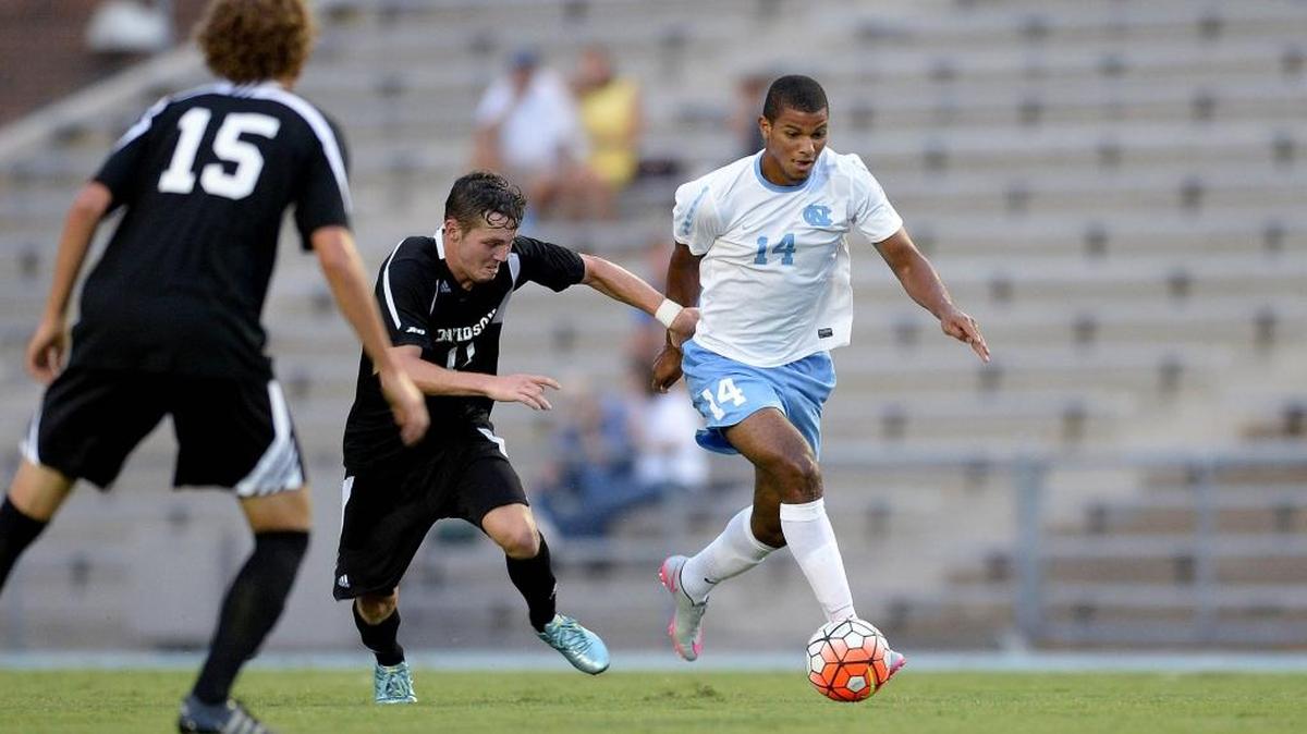 
North Carolina junior midfielder Omar Holness (right), shown during an exhibition against Davidson last week in Chapel Hill, is one of the Carolinas’ top men’s soccer players.
