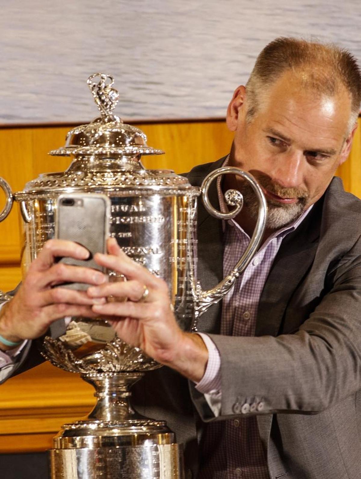 Former Carolina Panthers lineman Kevin Donnalley takes a selfie photo with the Wanamaker Trophy at the PGA Championship Media Day at Quail Hollow Club on Monday. In August, the club will host the PGA Championship.