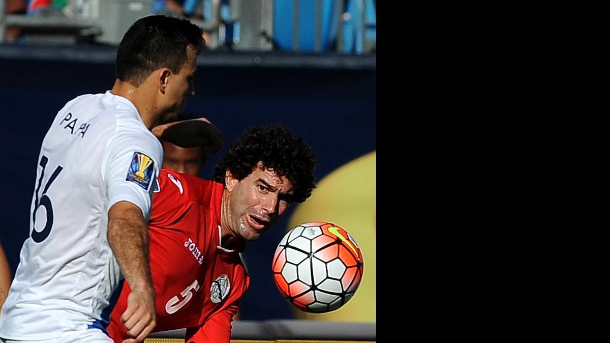 
Guatemala's Marco Pappa, left, and Cuba's Jorge Luis Clavelo, right, fight for control of the ball during first half action in Gold Cup '15 action at Bank of America Stadium in Charlotte on Wednesday, July 15, 2015.
