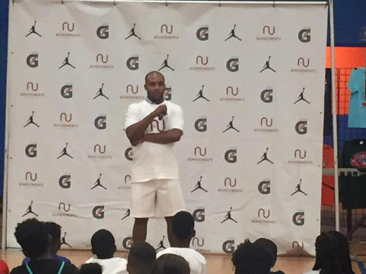 PGA Tour player Harold Varner III is shown speaking to campers ages 8 to17 last week at the annual Achievements Unlimited Basketball School in Indian Trail.