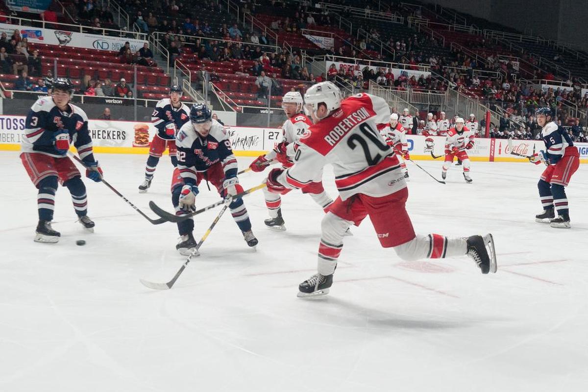 Charlotte Checkers’ Dennis Robertson scores the game-winner against the Hartford Wolf Pack with a shot through traffic during the second period Thursday.