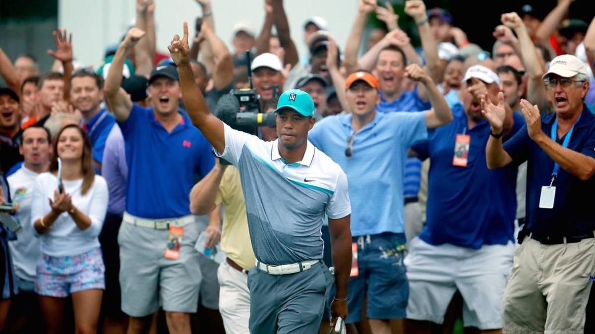 
Tiger Woods reacts after chipping in for birdie on the 10th hole during the first round of the Wyndham Championship at Sedgefield Country Club on August 20, 2015 in Greensboro.
