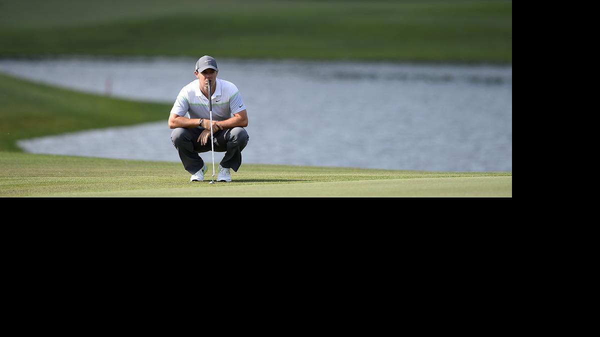 
Rory McIlroy studies the 16th green before putting during Saturday’s third round of the Wells Fargo Championship at Quail Hollow Club in Charlotte. McIlroy birdied the hole.
