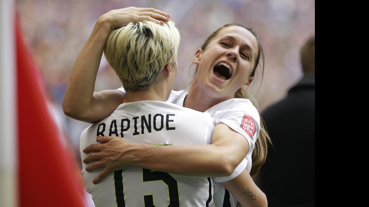 
United States’ Heather O’Reilly, right, hugs Megan Rapinoe after the U.S. beat Japan 5-2 in the FIFA Women’s World Cup soccer championship in Vancouver, British Columbia, Canada.
