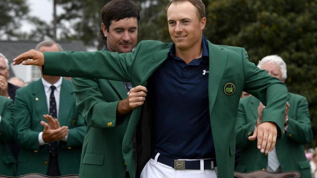 Bubba Watson, left, helps winner Jordan Spieth into his green jacket after last year’s Masters tournament. Spieth and Watson, who won the major in 2014, are among this week’s favorites.
