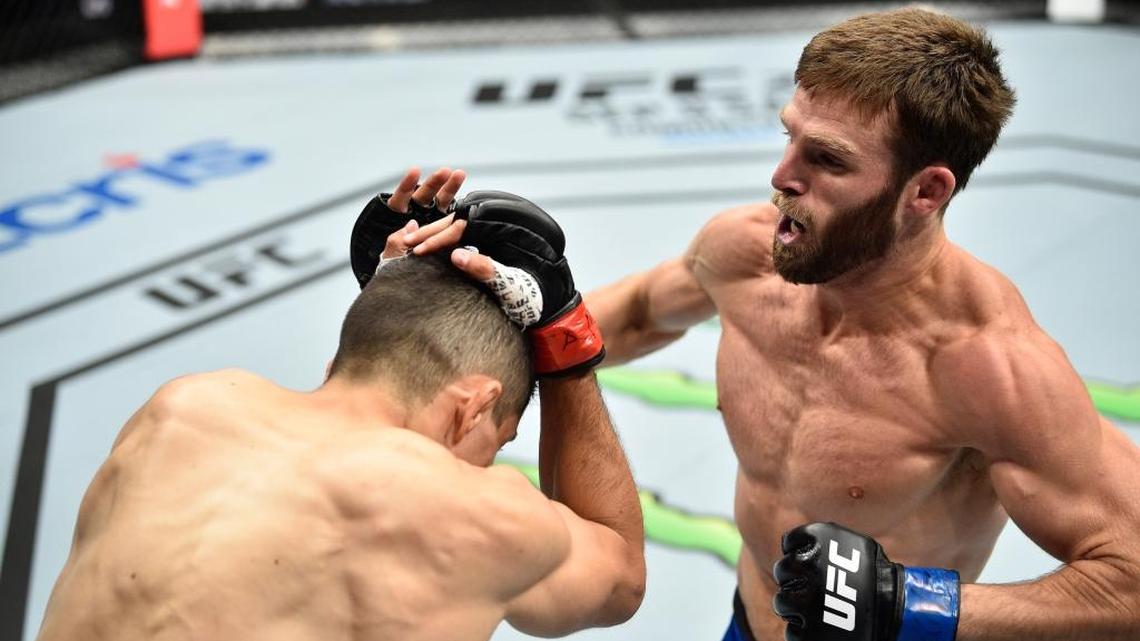 Jordan Rinaldi punches Alvaro Herrera of Mexico in their welterweight bout during the UFC Fight Night event at Arena Ciudad de Mexico on Aug. 5 in Mexico City.