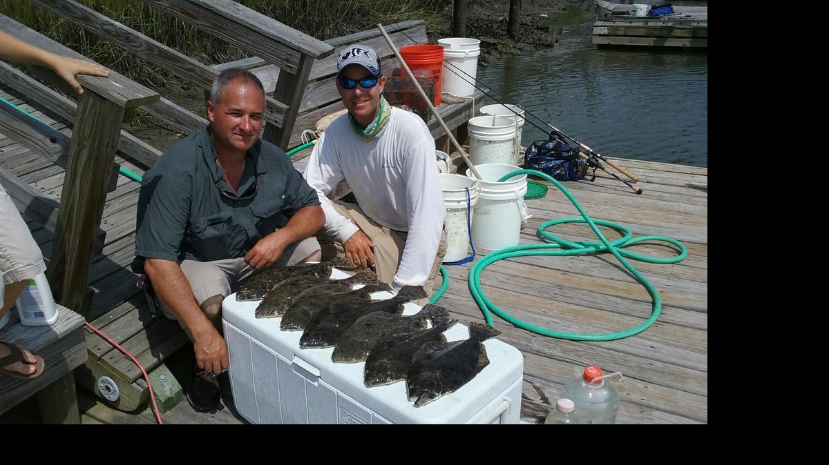 
Scott Rivers, left, of Polkton and guide Jacob Frick with a limit of six flounder caught in the backwaters of Southeastern N.C. The fish, averaging about 2 1/2 pounds, hit finger mullet baits. Frick operates out of Ocean Isle Fishing Center.
