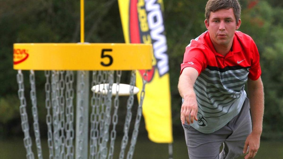 
Nate Sexton of Chapel Hill makes his birdie putt on the par-5, 1,083-foot, hole 5, during round three at the U.S. Disc Golf Championship played at Winthrop University Gold Course in Rock Hill, S.C. Friday Oct. 9, 2015. He leads by three strokes going into the final round.
