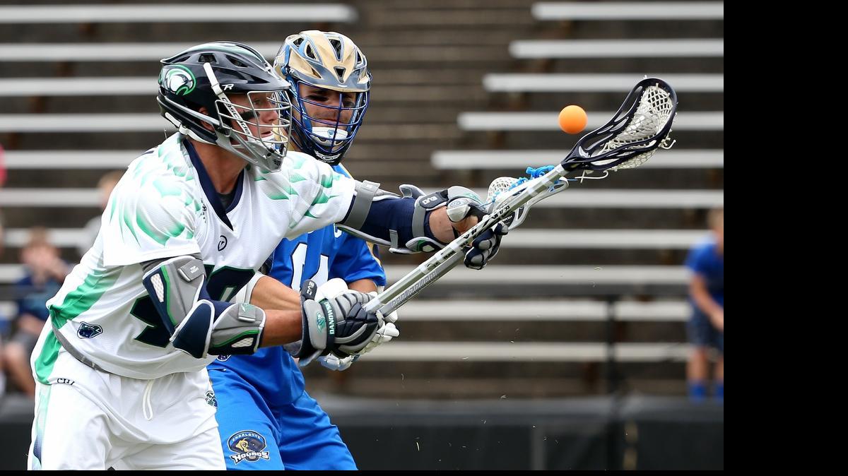 
Matt Danowski #40 of the Chesapeake Bayhawks and Joe Cinosky #84 of the Charlotte Hounds battle for the ball during their game at American Legion Memorial Stadium on May 10, 2015. 

