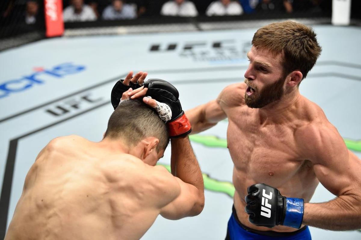Jordan Rinaldi punches Alvaro Herrera of Mexico in their welterweight bout during the UFC Fight Night event at Arena Ciudad de Mexico on Aug. 5, 2017, in Mexico City.